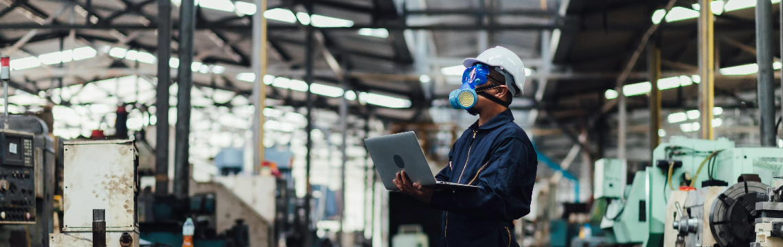 man in-protective-gear-manufacturing-plant