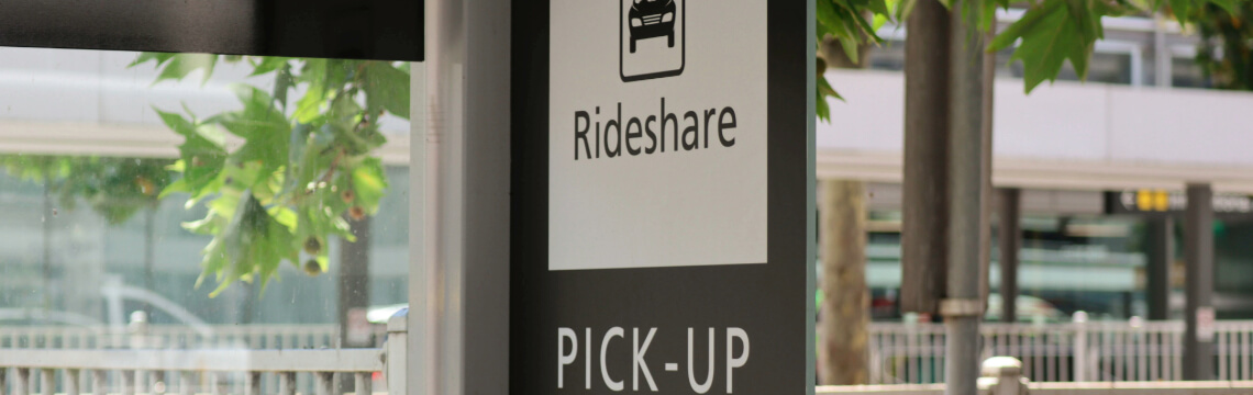 Rideshare pickup here sign.