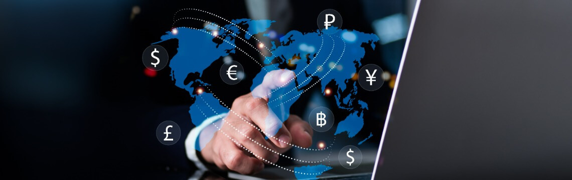 hand and online map of world with currency icons